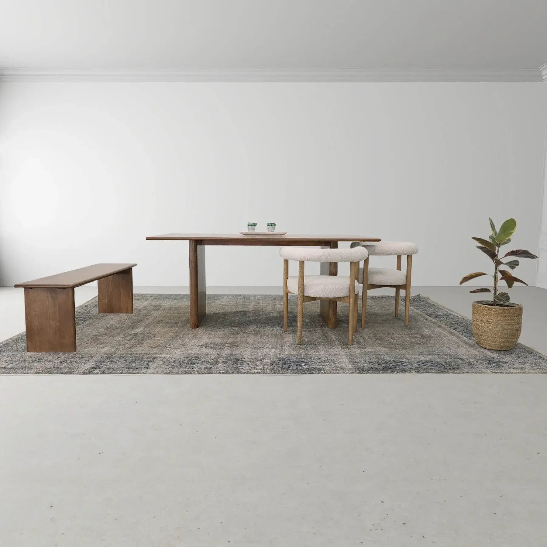 Dallas Solid Wood Dining Table set up with modern chairs and bench, showing a minimalist dining room décor.