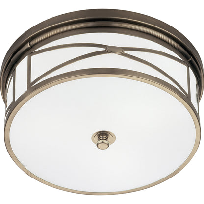 Dark antique nickel dining room flushmount with frosted glass shade for a warm glow.