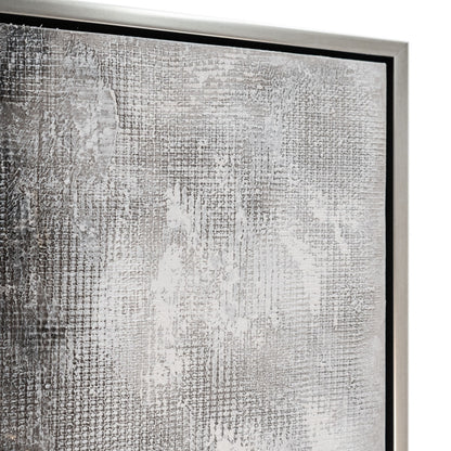 Close-up of textured grey abstract wall art with a sleek silver floater frame.