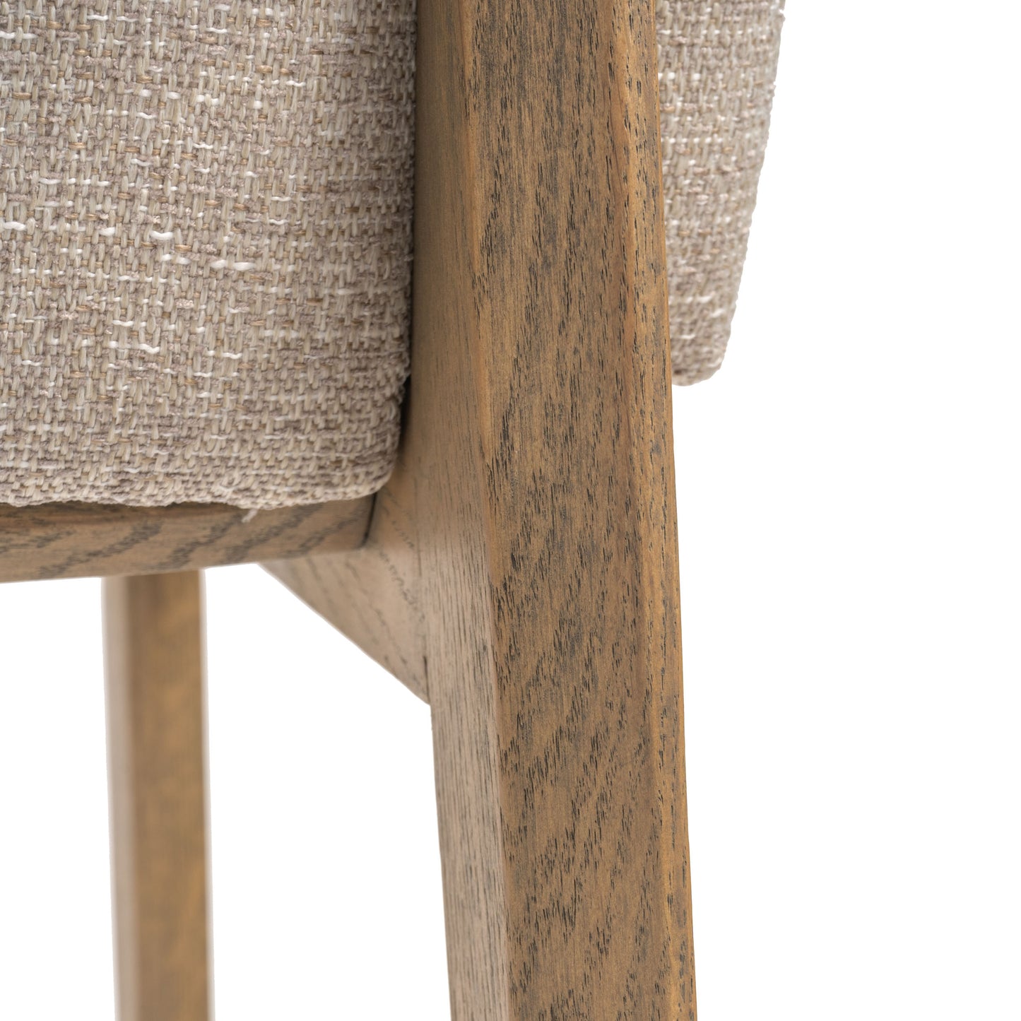 Close-up view of a beige upholstered seat and wood frame.