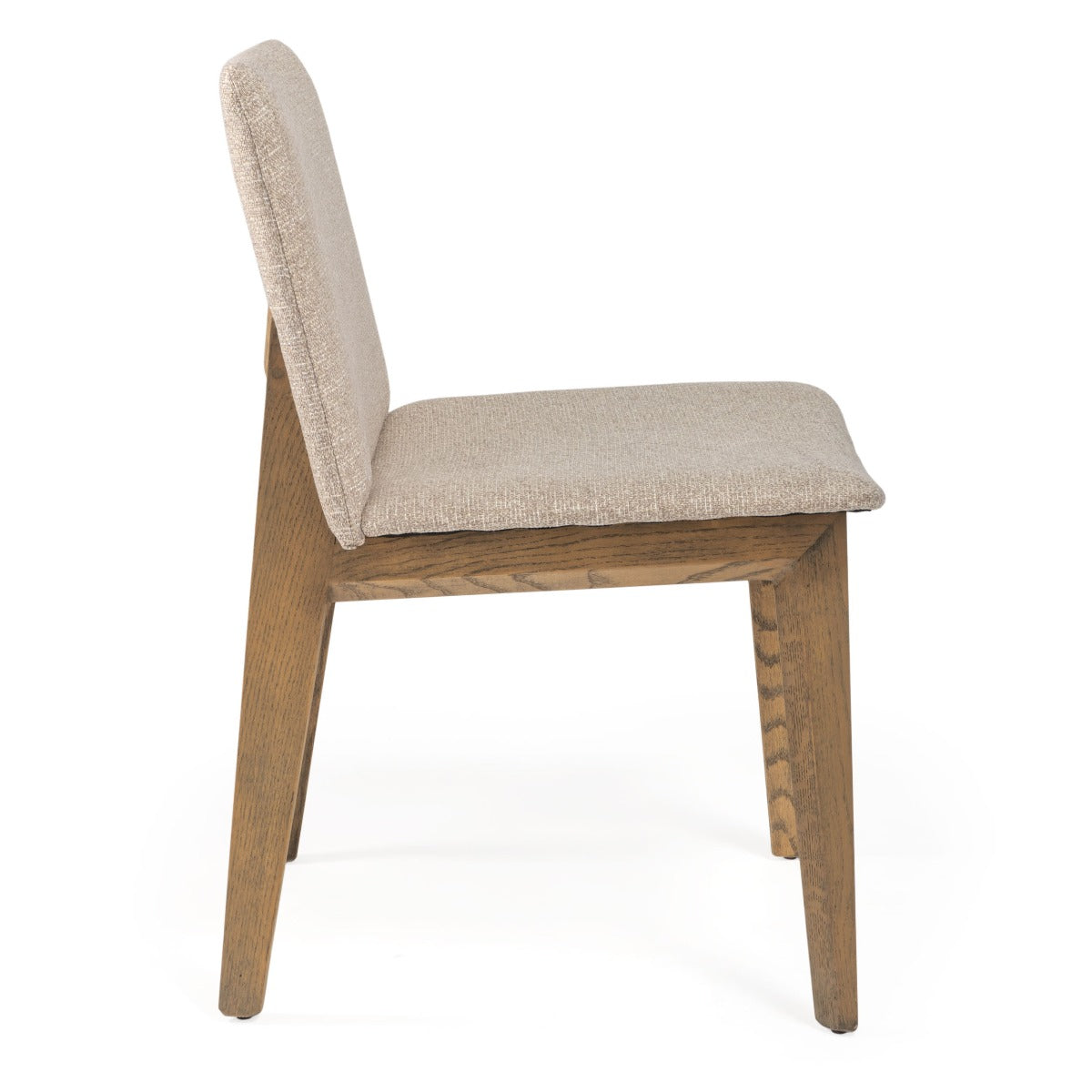 Side profile of a modern beige fabric dining chair with solid wood legs.