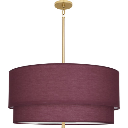 A two-tiered hanging pendant light with a vintage wine fabric shade and a brass finish, creating a modern aesthetic.