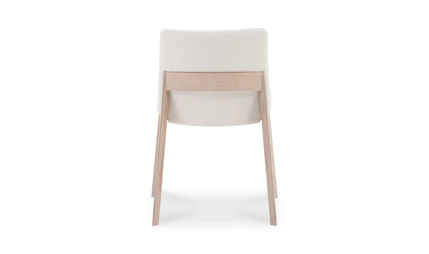 Back view of the Deco Cream Dining Chair displaying the sturdy oak frame and seamless upholstery.