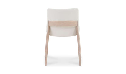 Back view of the Deco Cream Dining Chair displaying the sturdy oak frame and seamless upholstery.