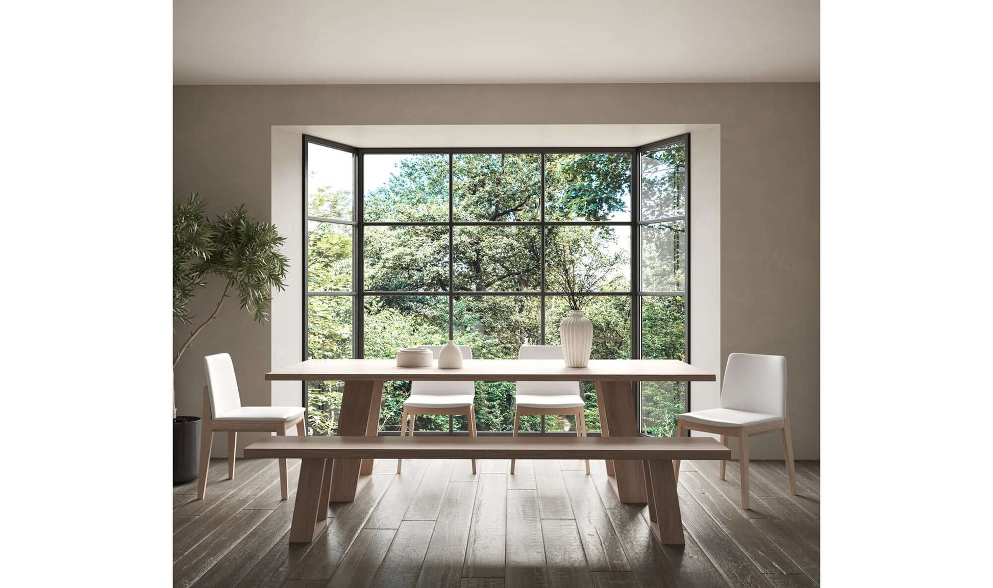 The Deco Cream Dining Chair set in a modern dining room with a large window view.