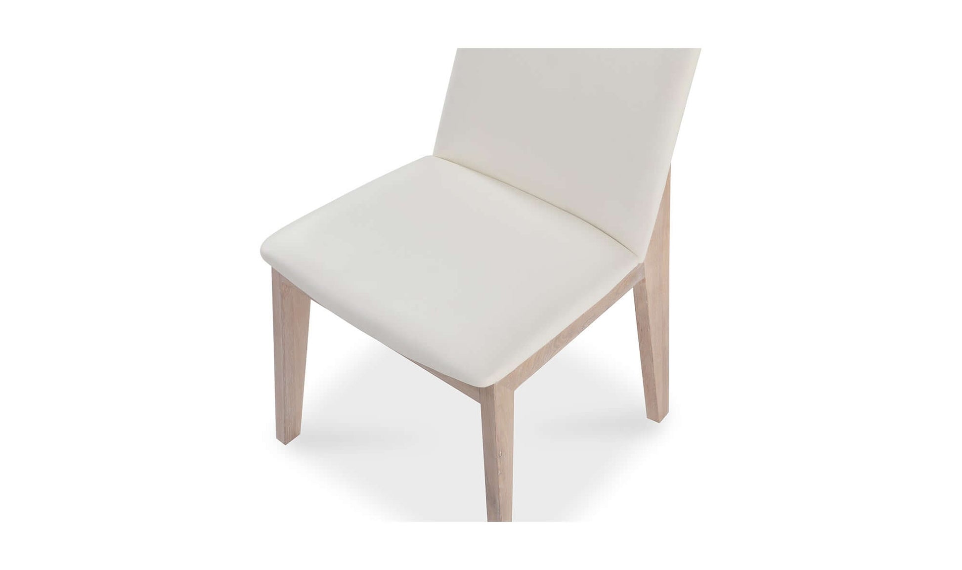 Top view of the Deco Cream Dining Chair’s seat with cream vegan leather upholstery.