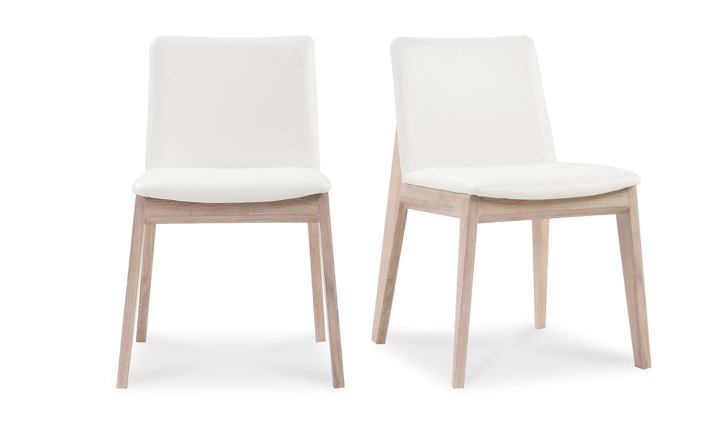 Front view of two Deco Cream Dining Chairs showcasing the elegant design and solid oak frame.