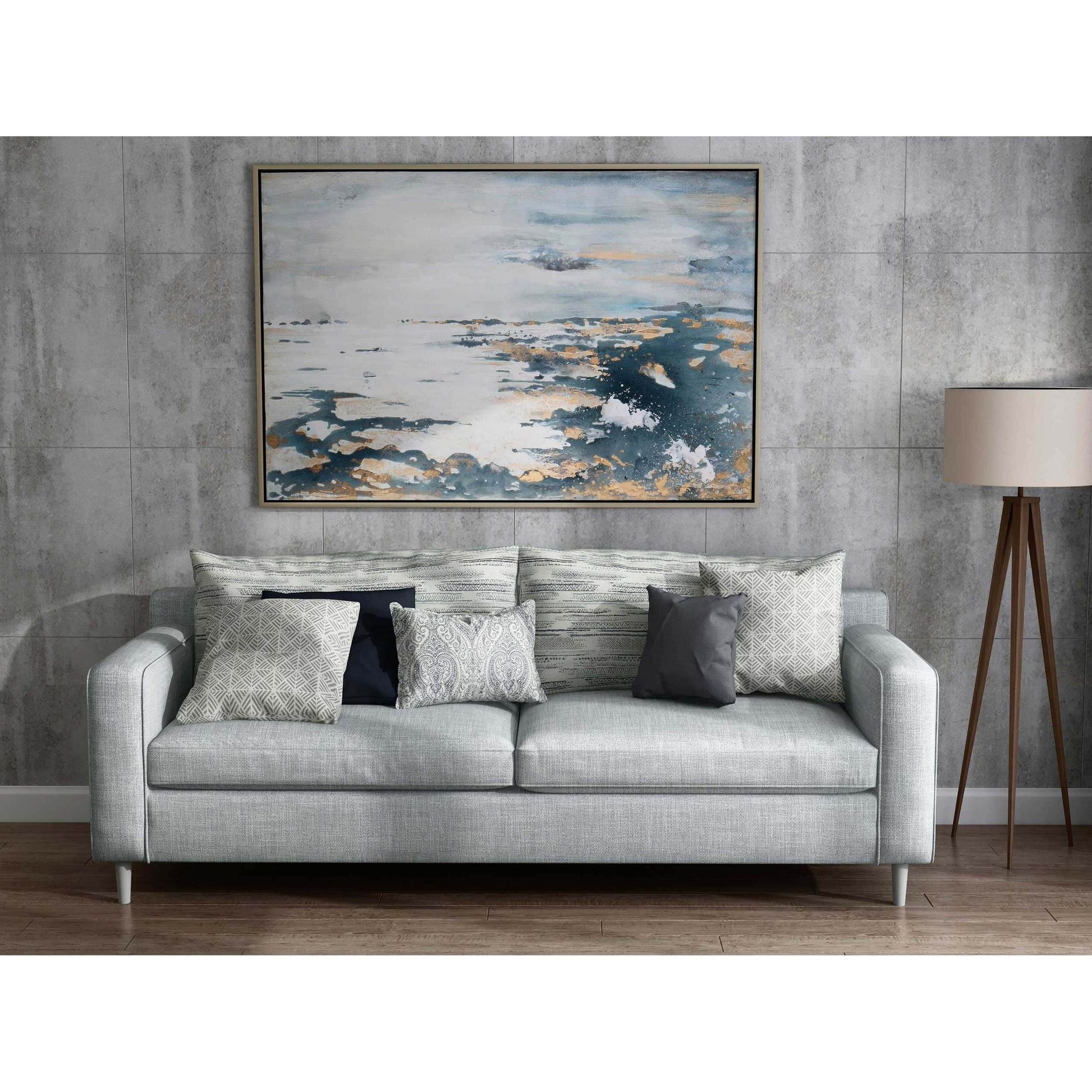 Large blue and gray canvas displayed above a modern sofa.