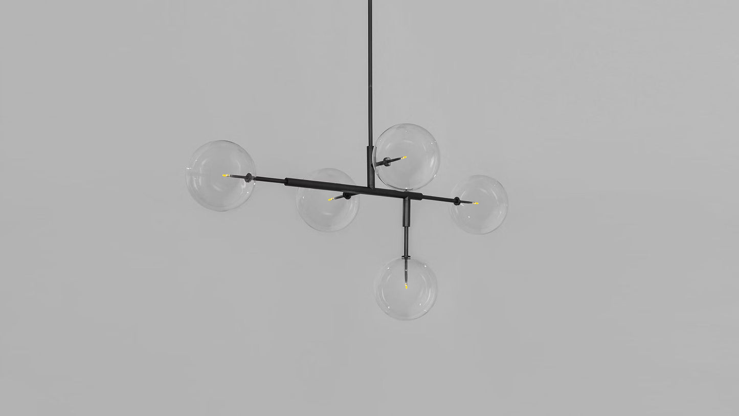 Dimmed chandelier showing sleek geometric structure in black finish.