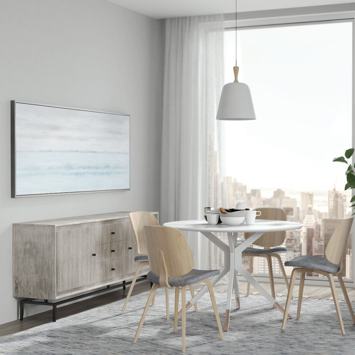 Dining room featuring Blue Horizon painting above a wood sideboard and modern table.