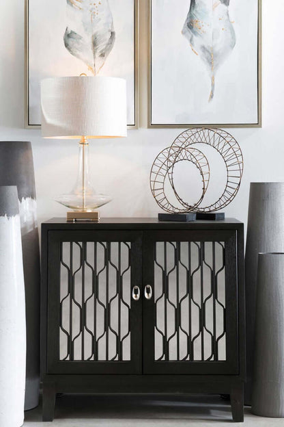 Modern interior décor showcasing Plume S2 feather paintings above a black cabinet.