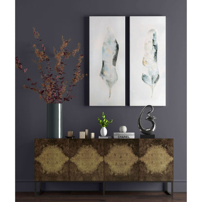 Elegant wall art arrangement featuring Plume S2 feather paintings on a dark gray wall.