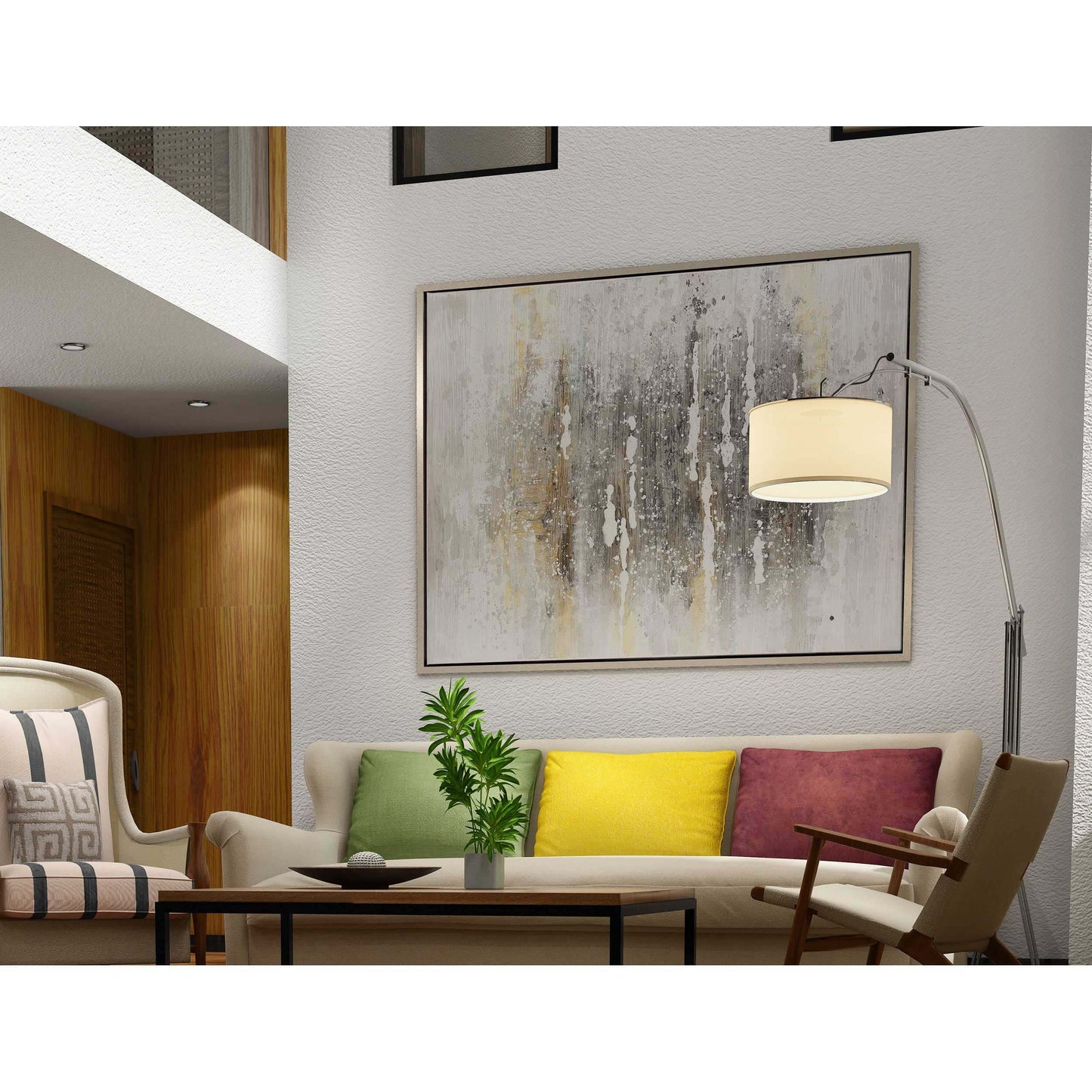 Grey abstract painting displayed on a modern living room wall with colorful cushions.