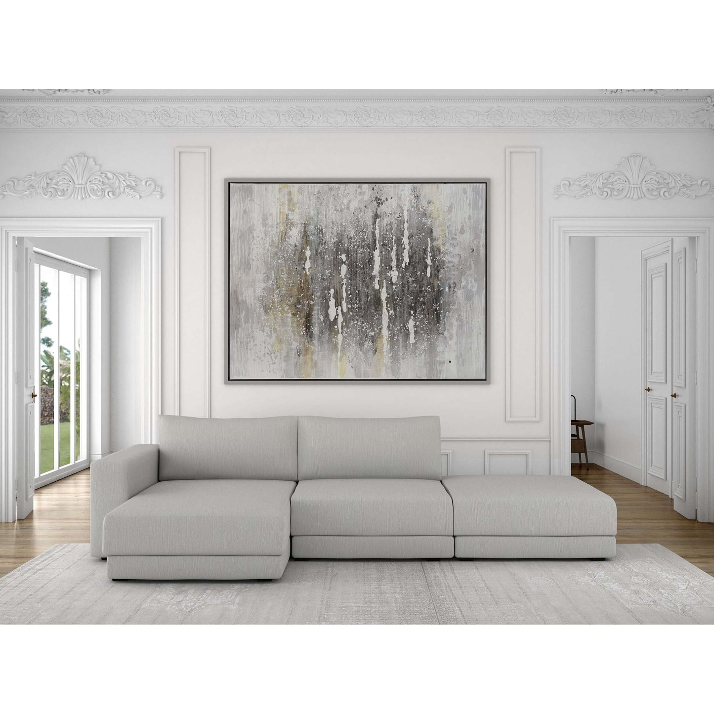 Large abstract canvas artwork in a minimalist white room above a sectional sofa.