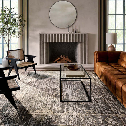 Cozy living room with a fireplace and rattan dining arm chairs.