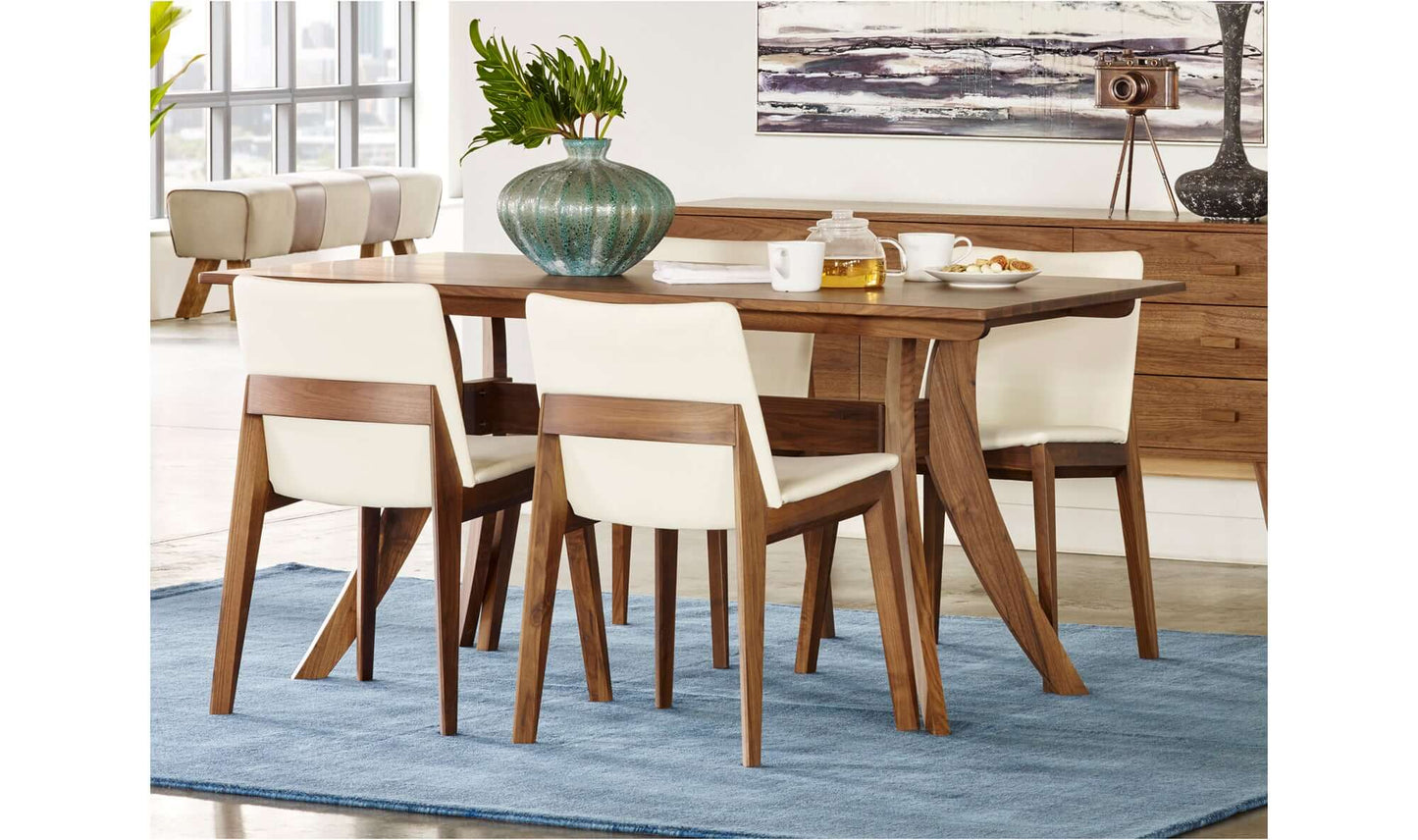 Lifestyle image of the Florence Small Brown Dining Table in a modern dining room setting