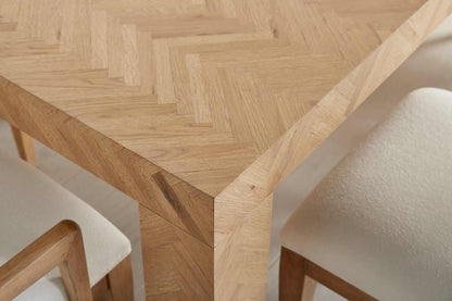 Close-up of the herringbone pattern on the Garrison Casual Dining Room Table.