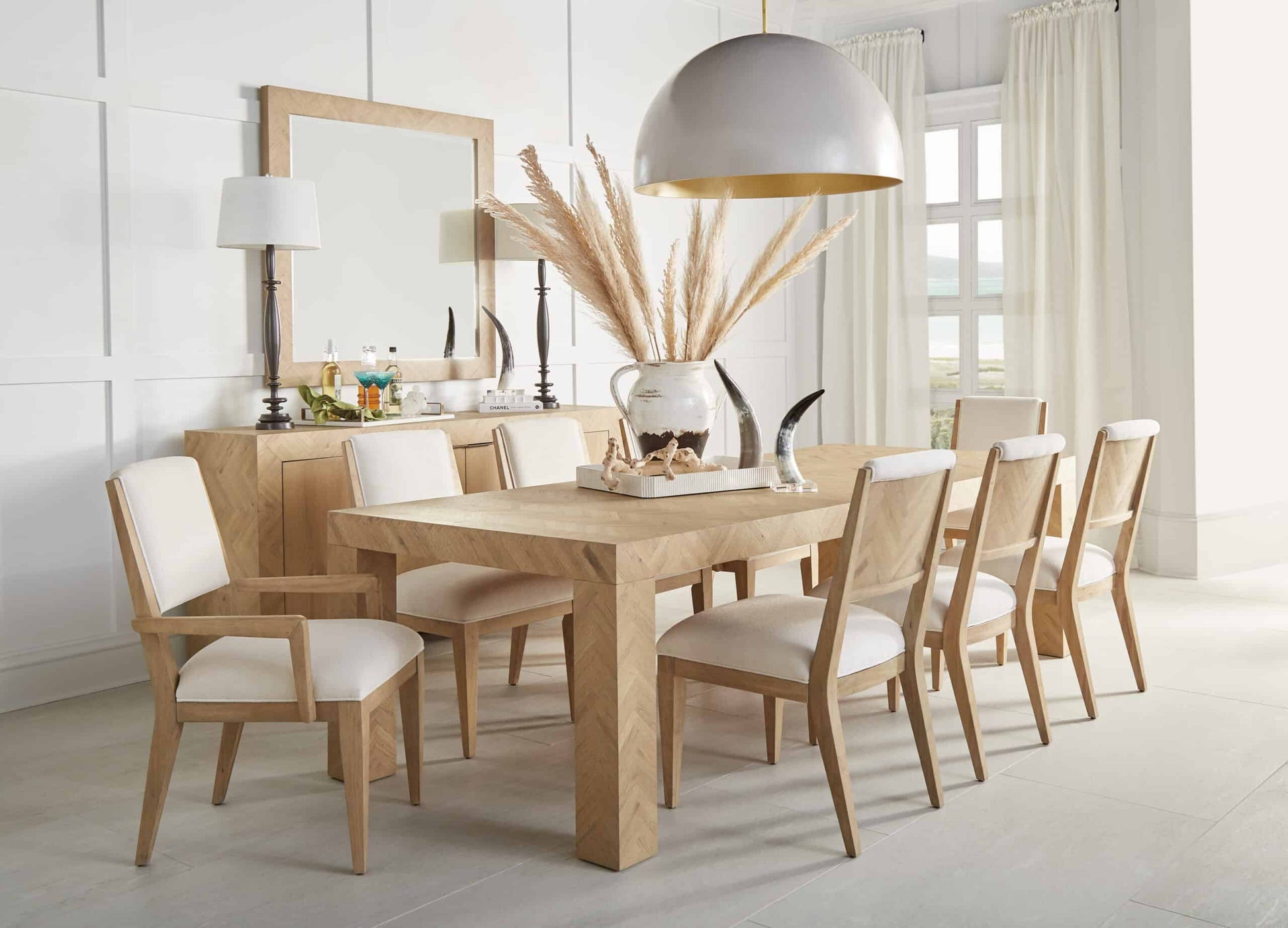  Dining room with Garrison Contemporary Wooden Dining Table, seating six, in a modern space with soft lighting and Washed Oak finish.