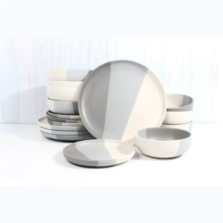 Piermont modern dinnerware set in grey and white featuring sleek, geometric designs on plates and bowls.