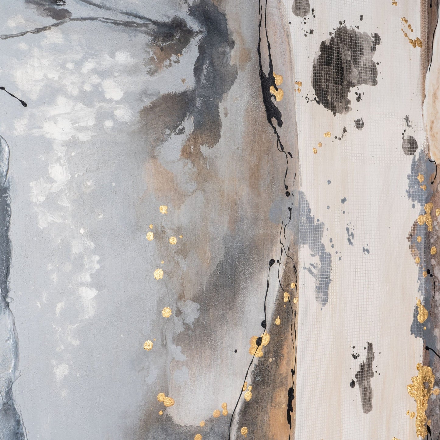 Close-up of gold leaf detailing on the abstract painting.