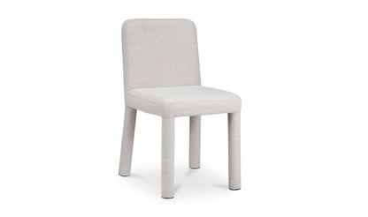 Light grey contemporary dining chair with sleek design in a minimalistic setting.