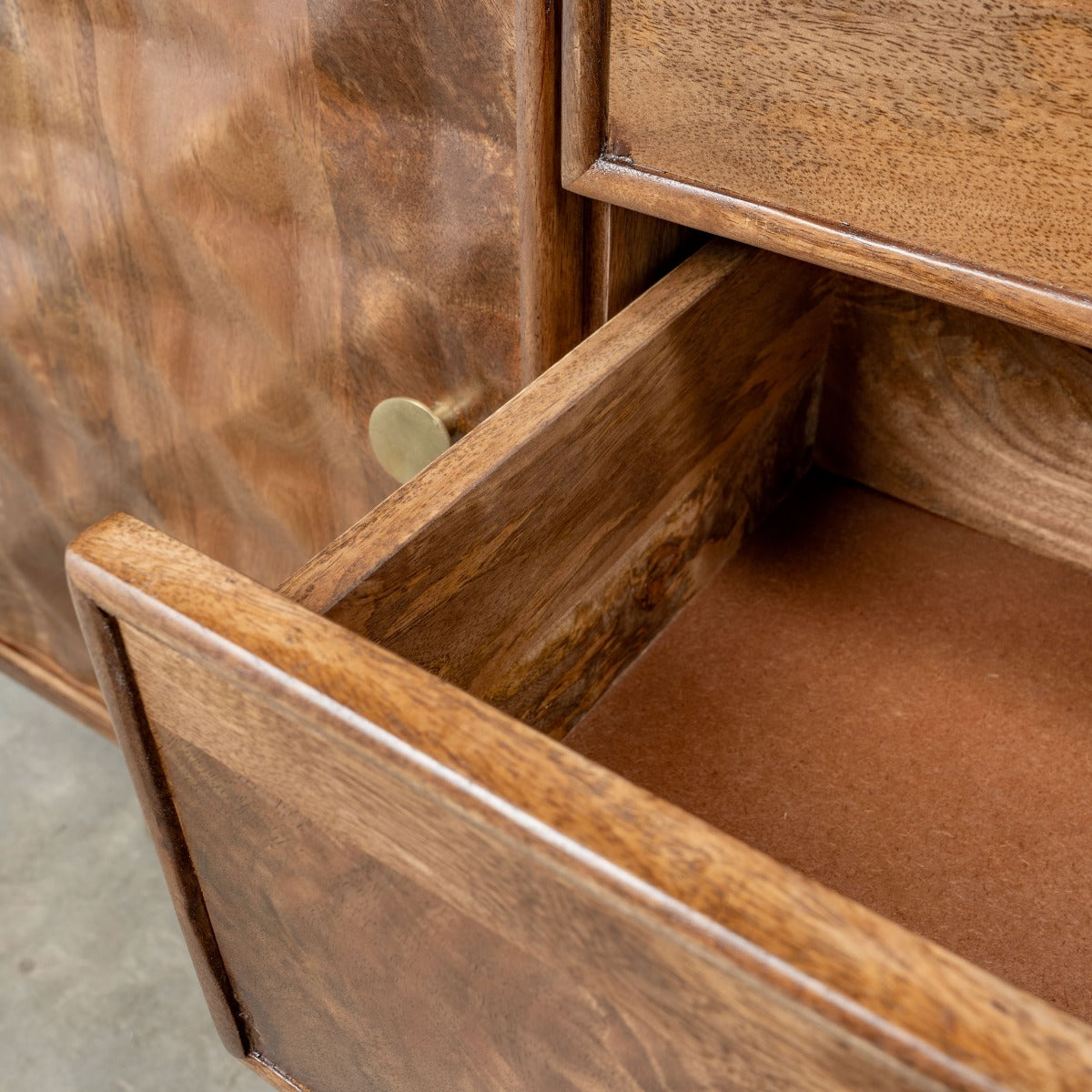 Open drawer detail showcasing interior storage space.