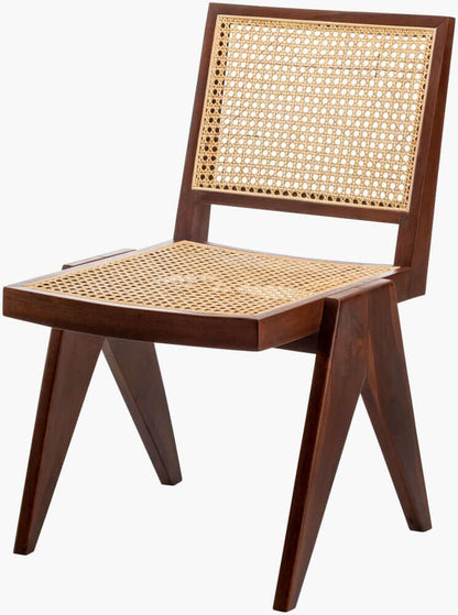 Angled view of the Hague Dining Chair, showing the intricate rattan weaving and robust wooden construction.