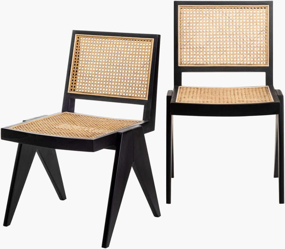 Two Hague Dining Chairs in black and natural wood finish, featuring rattan seats and backrests.