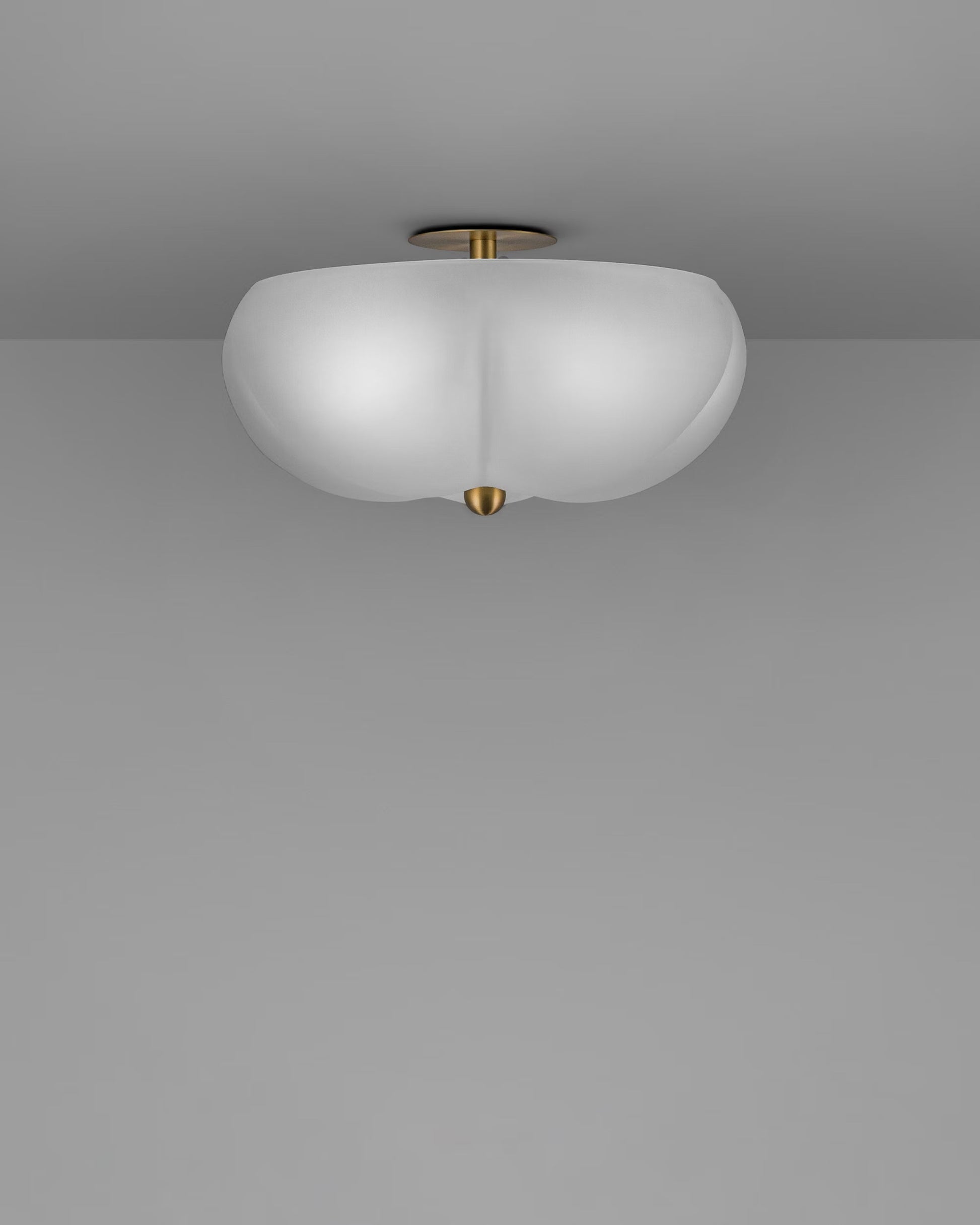 Side view of Hana Flush Mount ceiling fixture with frosted glass shade and brass hardware.