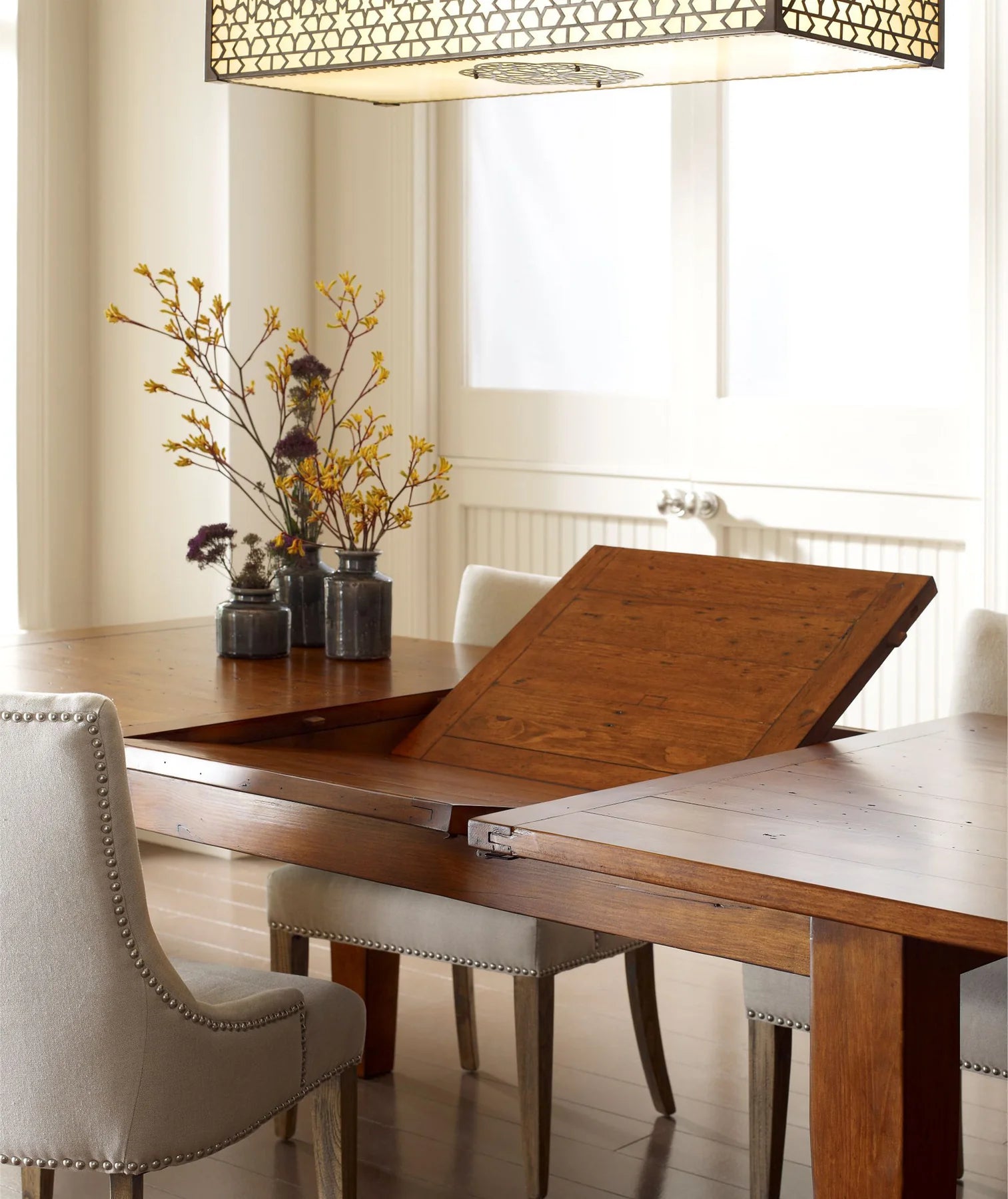  Close-up view of butterfly extension mechanism on the Irish Coast Rustic Extension Dining Table.