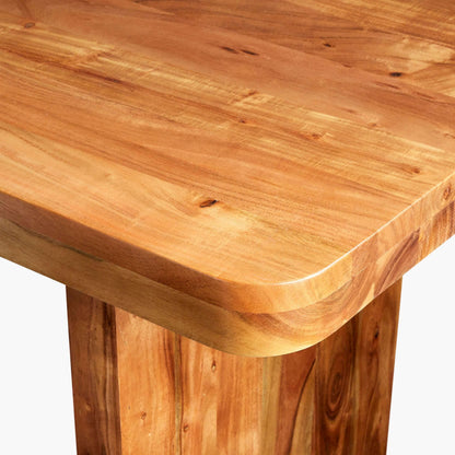 Close-up of the corner detail of the Joiner Dining Table, highlighting the smooth rounded edges.