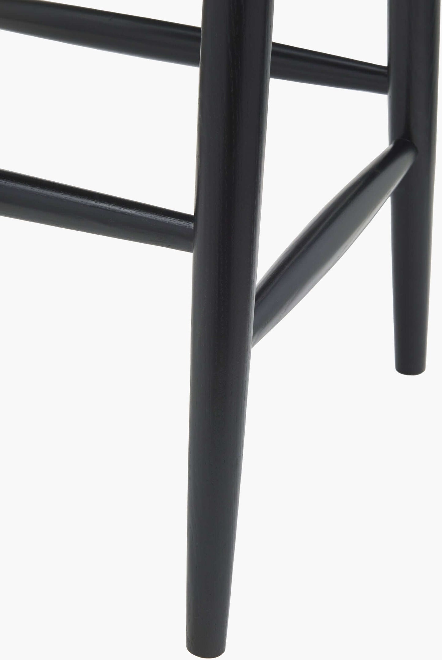 Close-up view of the leg of the Kisco Bar Stool, showing the sturdy black wooden construction and sleek design.