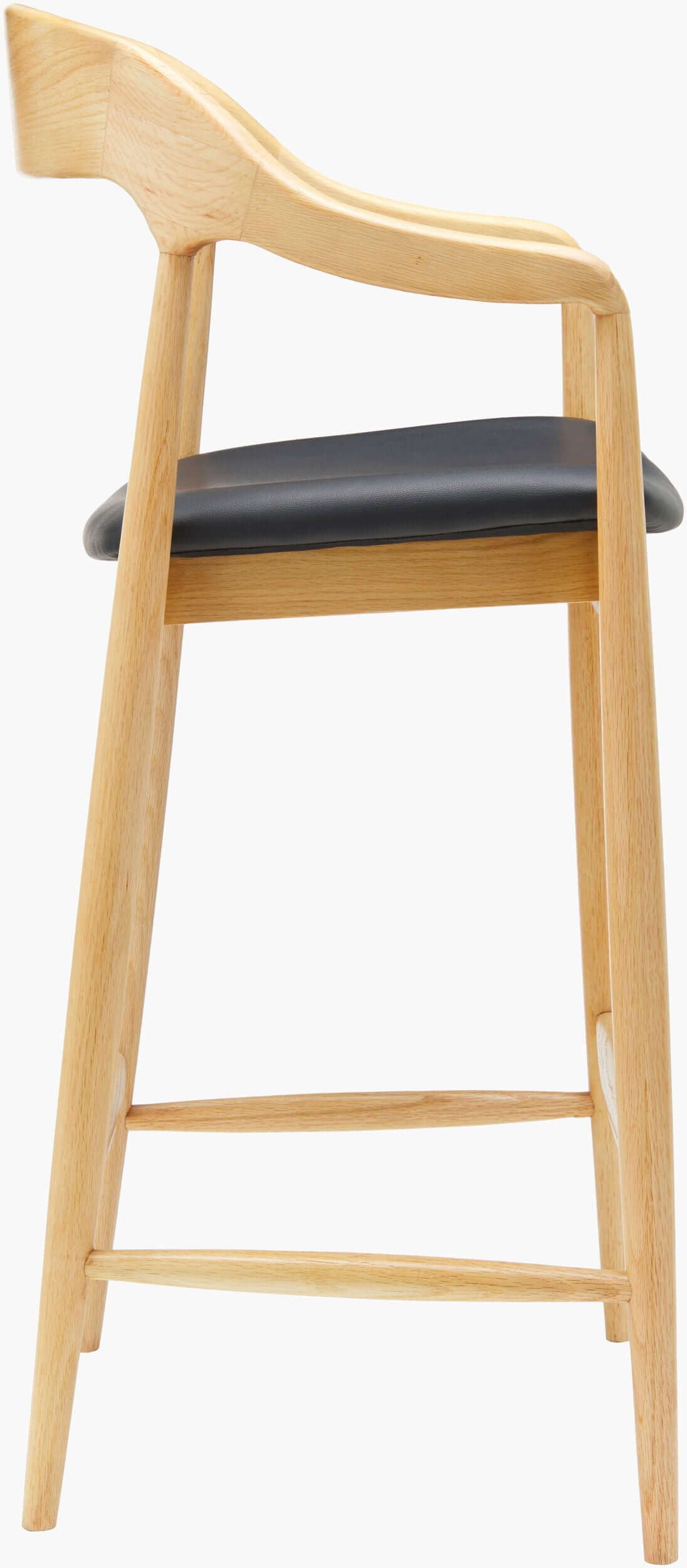 Side profile of the Kisco Natural Bar Stool by Surya, highlighting the elegant natural ash wood frame and black faux leather seat.