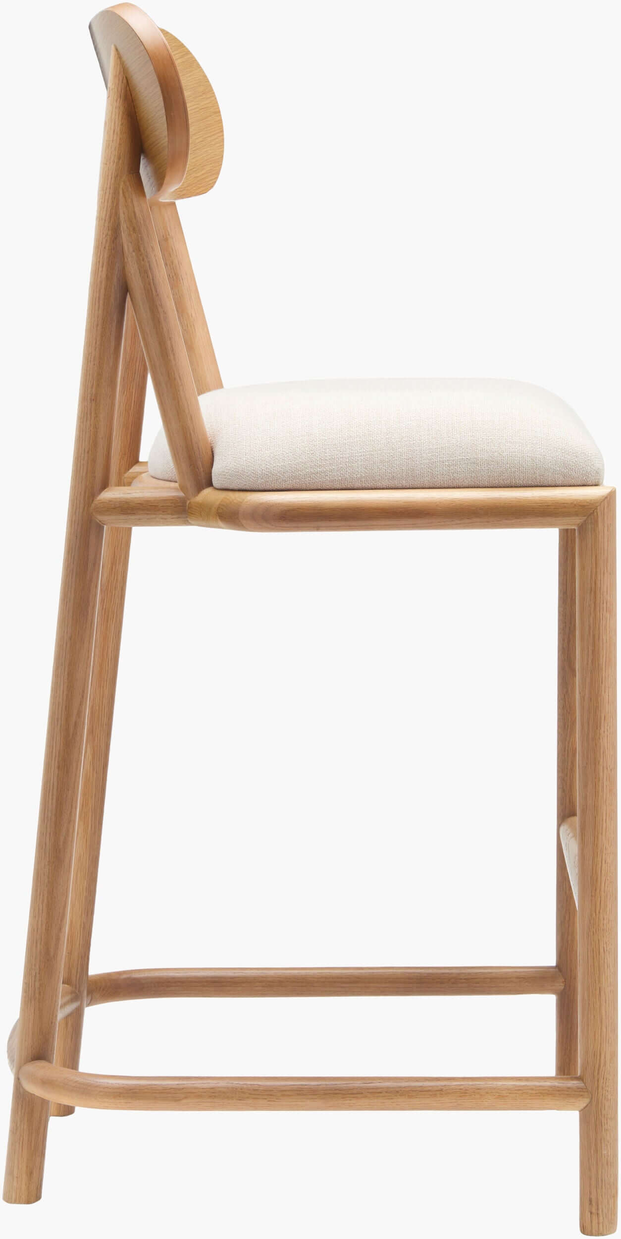 Detailed side view of the Keating Bar Stool's plush polyester seat.