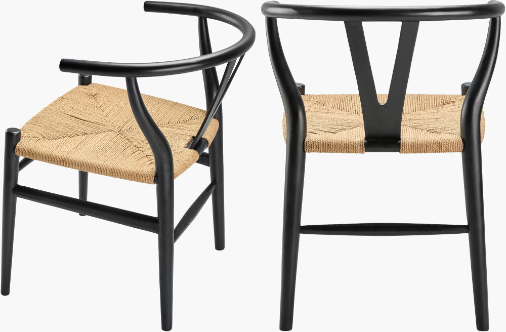 Black teak wood dining chairs with handwoven seagrass seats, back views.