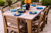 Antique Mahogany Island Poly Wood Dining Table set up outdoors, showcasing its spacious dimensions and sturdy build.