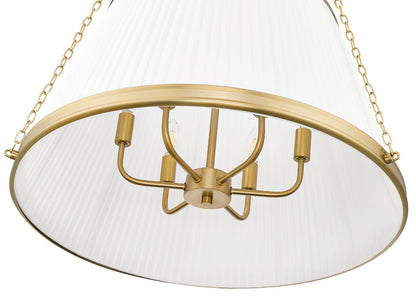close-up view of modern gold pendant light showing pleated white shade and bulb detail.