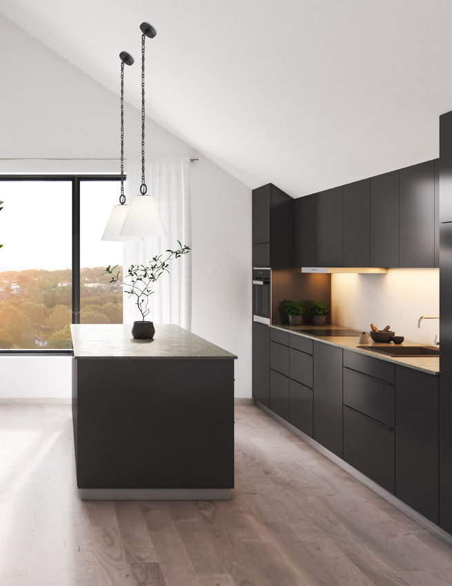 matte black Aralic pendant light hanging over modern island.