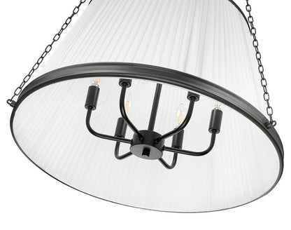 close-up view of matte black pendant light with candelabra bulbs and pleated shade.