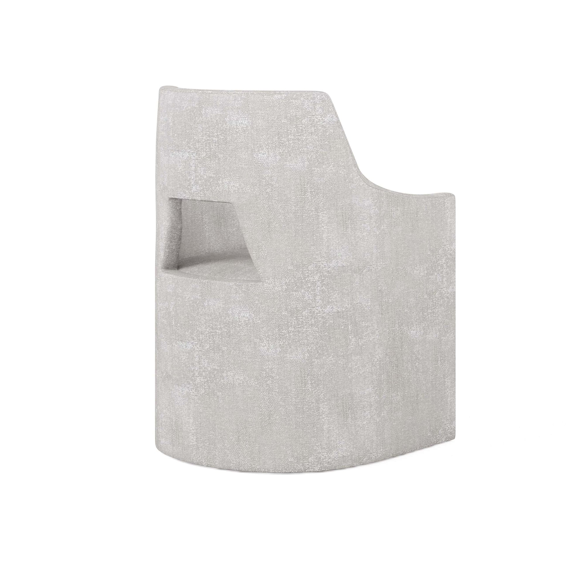 Rear side view of the Mezzanine grey dining arm chair showing the cutout back design and smooth texture.