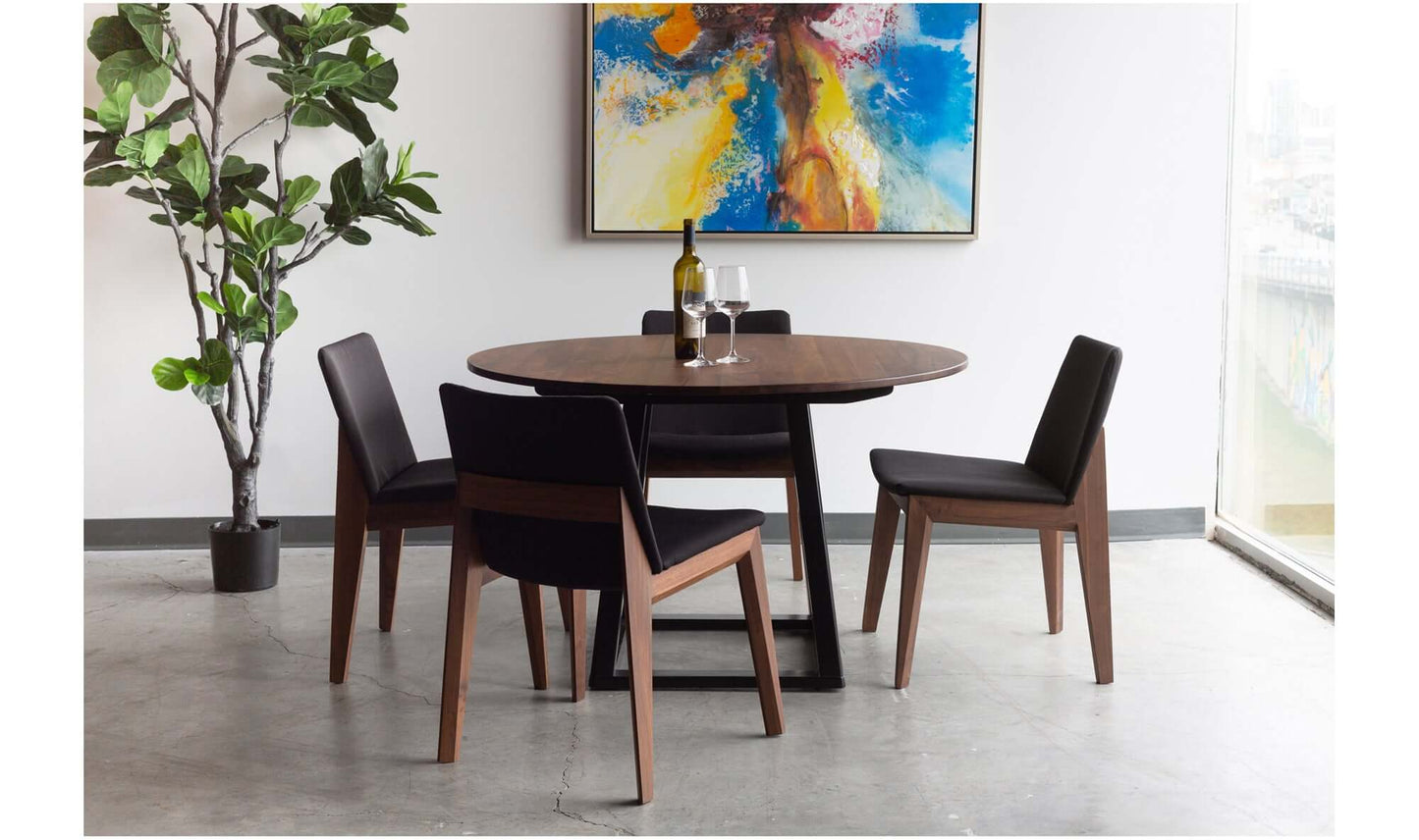 Lifestyle image of Deco Black Dining Chair in a dining room setting.