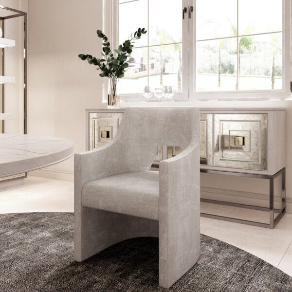 Close-up of a modern accent chair in front of the Mezzanine Transitional Accent Console,