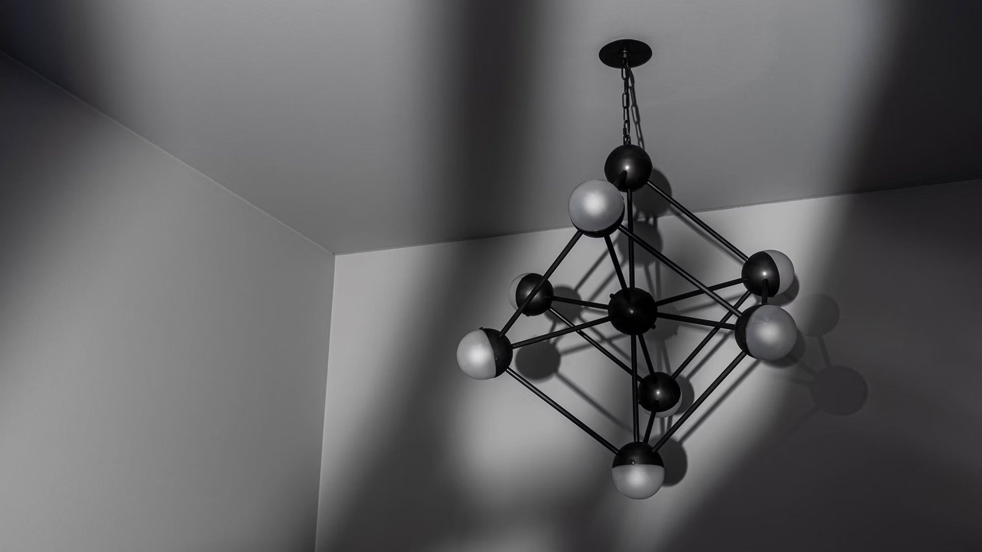 Shadow-casting Molecule Chandelier with a bold industrial framework.