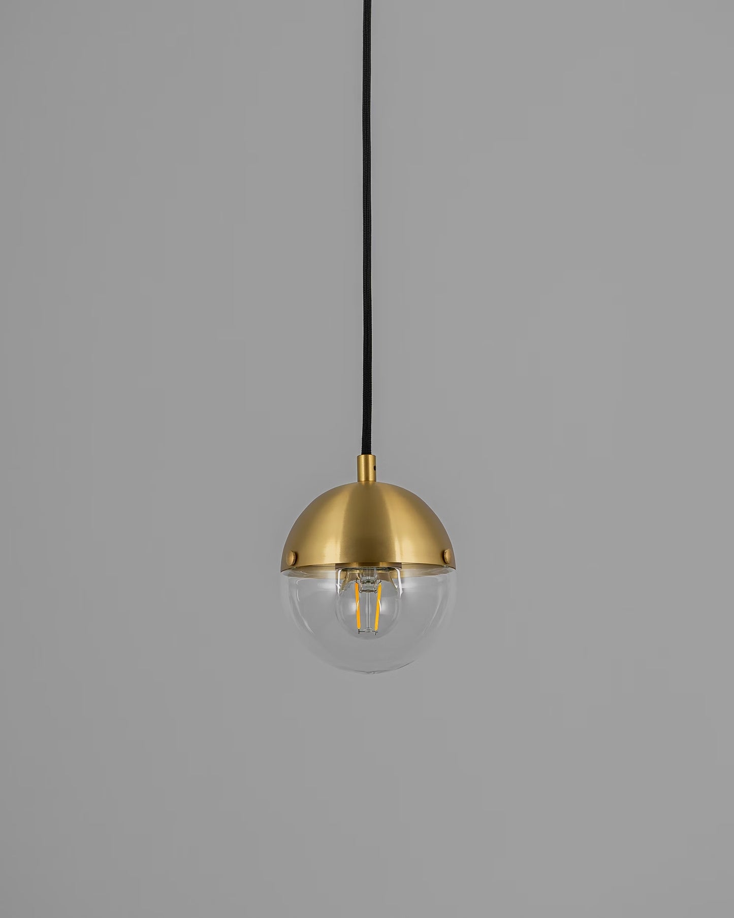 Molecule Pendant Light with transparent glass and brass finish, turned off.