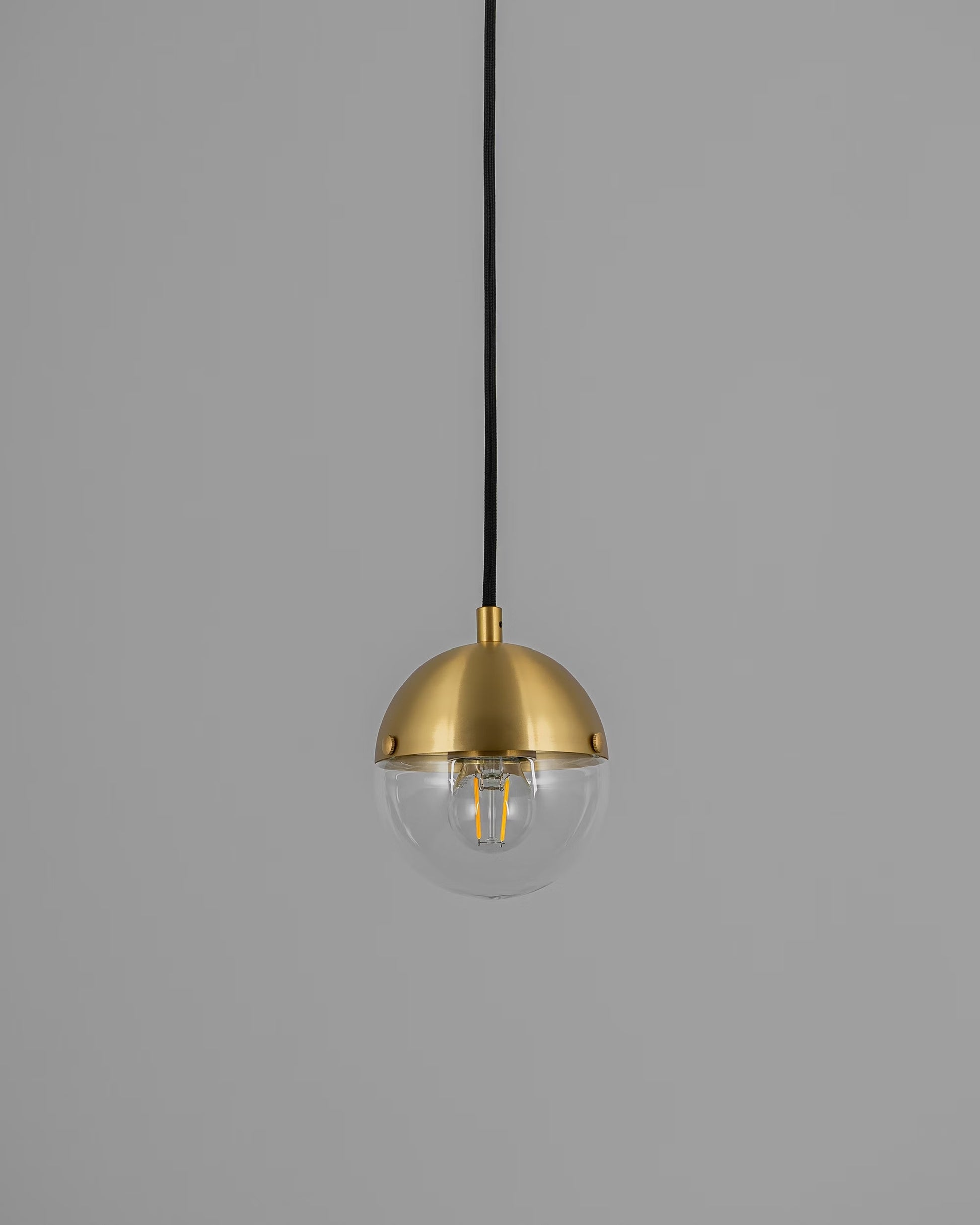 Molecule Pendant Light with transparent glass and brass finish, turned off.