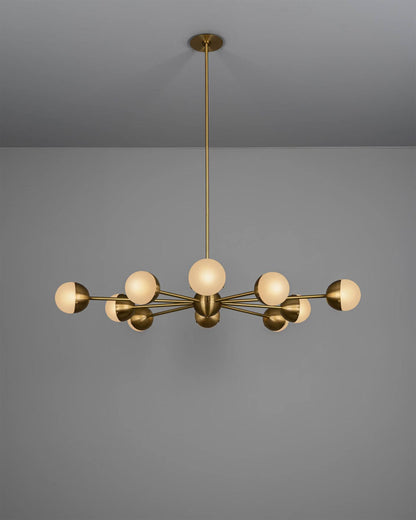 Molecule Spark Round 10 chandelier illuminated, showcasing its warm glow and artisanal details.