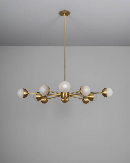 Molecule Spark Round 10 Chandelier with frosted glass globes and brass arms, turned off.