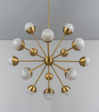 Brass chandelier with frosted glass globes and clean lines