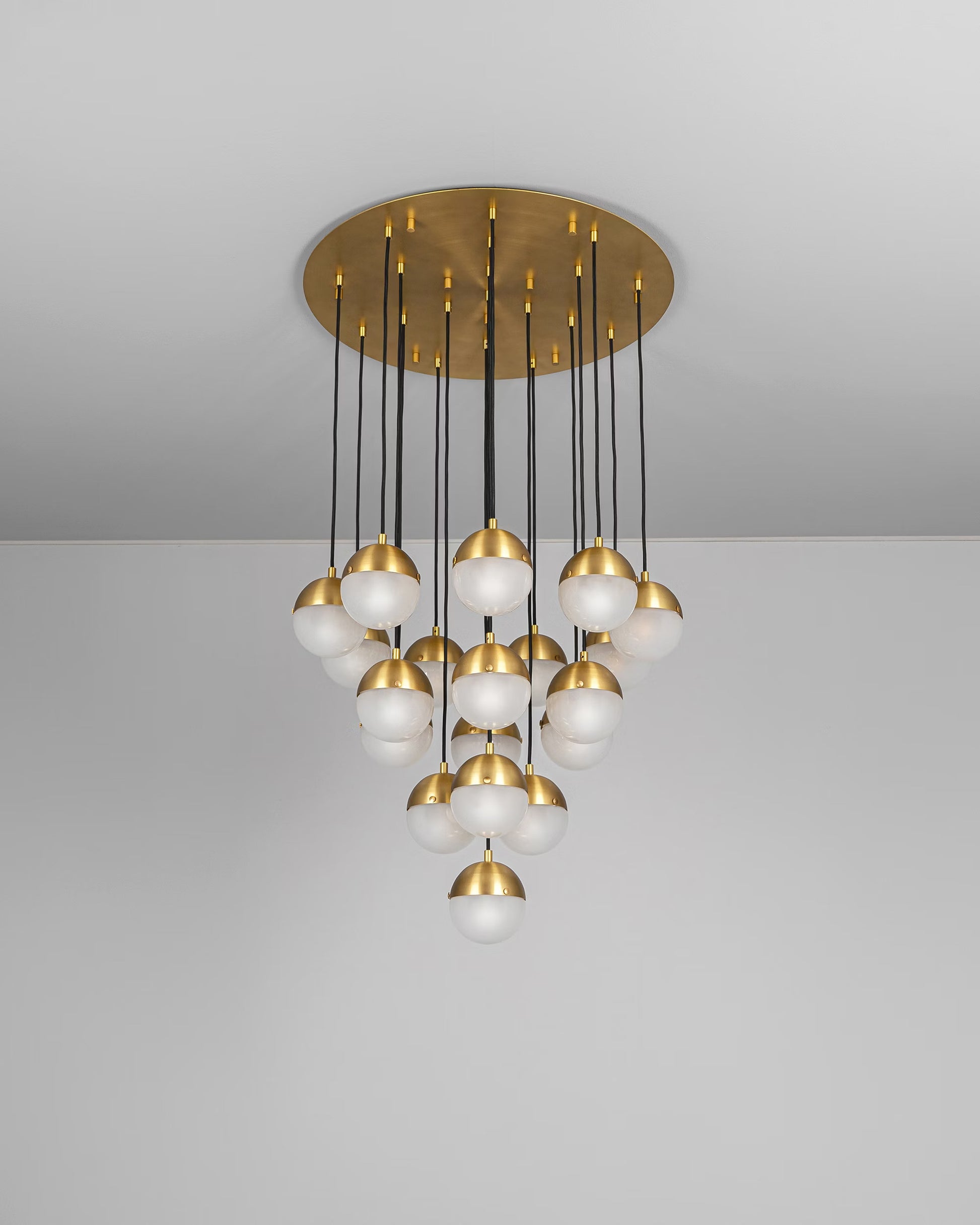 Molecule Cluster 19 Chandelier with frosted glass globes and burnished brass frame, unlit.