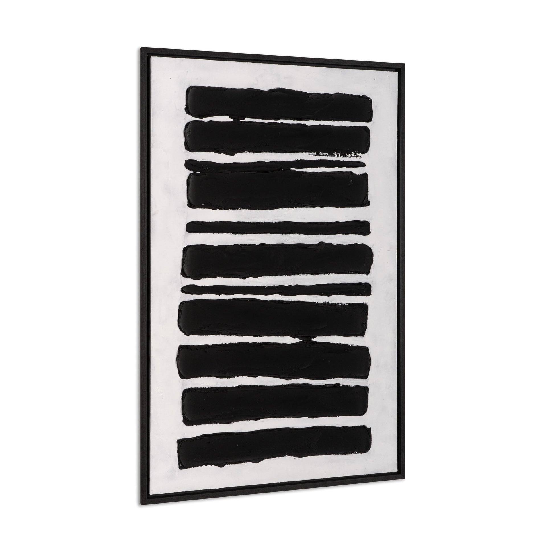 Angled side view of framed black and white abstract canvas art.